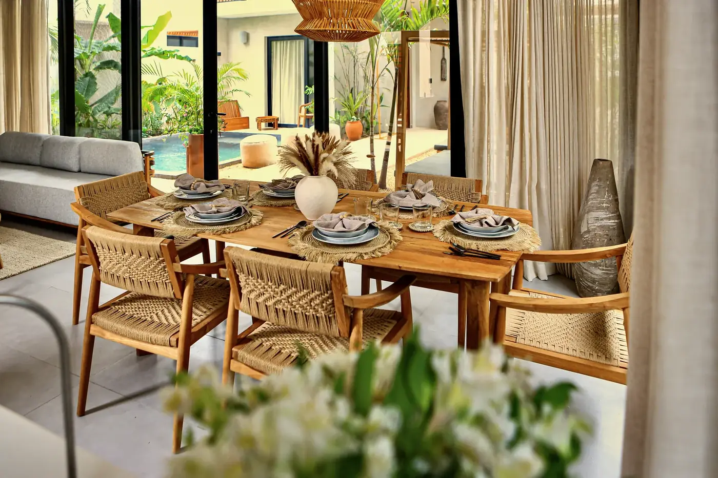 The dining table set for eight, open to the courtyard